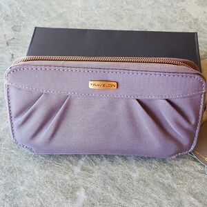Wristlet by Travelon grey with purple lining lots of compartments cip on strap